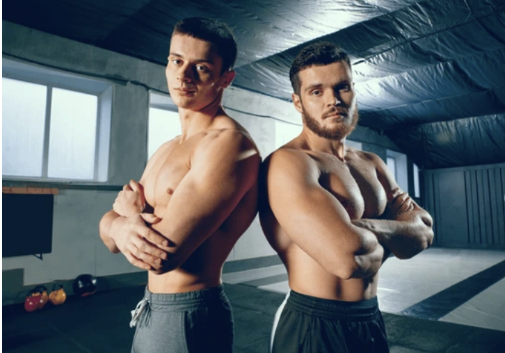 Men Comparing each other physic and wondering about their inner wealth